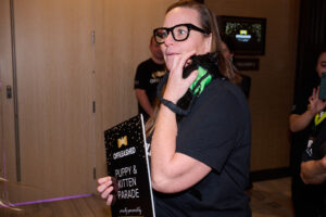 A volunteer holding a kitten at BC SPCA's Offleashed Vancouver Gala 2023