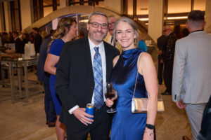 A smiling couple at BC SPCA's Offleashed Vancouver Gala 2023