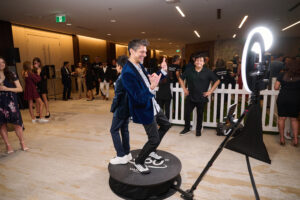 A man and a child at the 360 photo booth at BC SPCA's Offleashed Vancouver Gala 2023