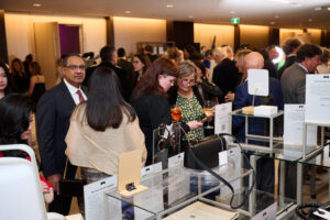 Guests looking at silent auction items at BC SPCA's Offleashed Vancouver Gala 2023