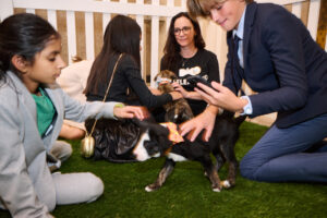 Children with a puppy at BC SPCA's Offleashed Vancouver Gala 2023