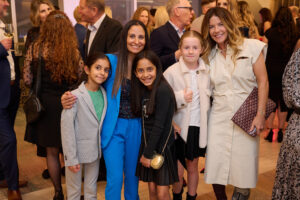 A group photo with children at BC SPCA's Offleashed Vancouver Gala 2023