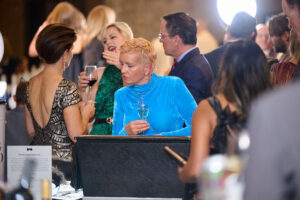 A guest looking at silent auction items at BC SPCA's Offleashed Vancouver Gala 2023