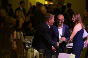 Three guests in conversation at BC SPCA's Offleashed Vancouver Gala 2023